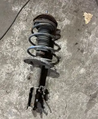 Toyota Corolla E140 E150 Front shock absorber with coil spring 