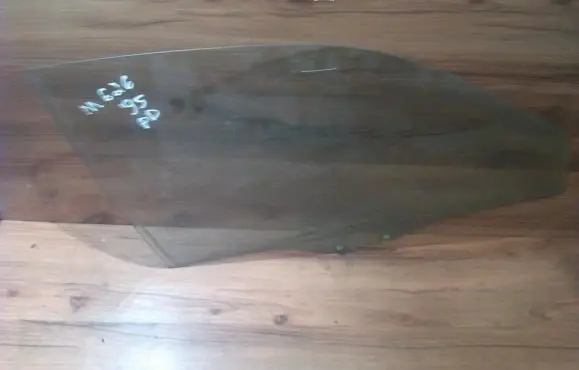 Mazda 626 Front door window glass four-door
