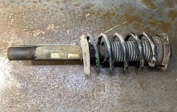 Volkswagen Caddy Front shock absorber with coil spring 1K0412021