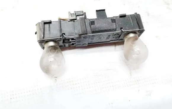 Tail light bulb cover holder