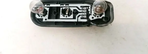 Tail light bulb cover holder