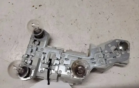 Volvo V50 Tail light bulb cover holder