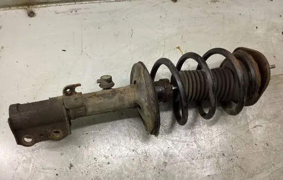 Front shock absorber with coil spring