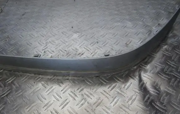 Rear bumper trim bar molding