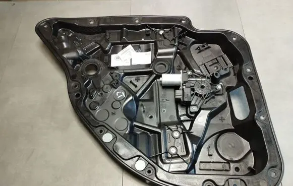 Rear door window regulator with motor