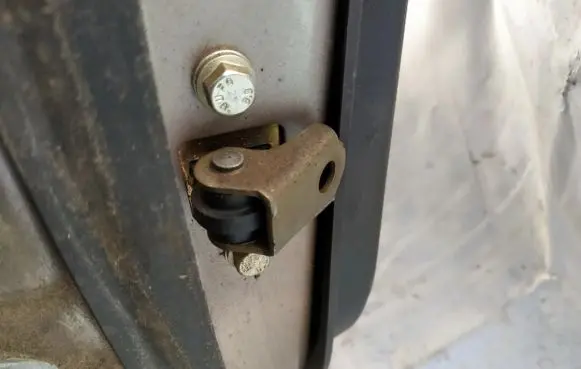 Rear door check strap stopper