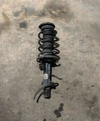Peugeot 208 I Front shock absorber with coil spring 