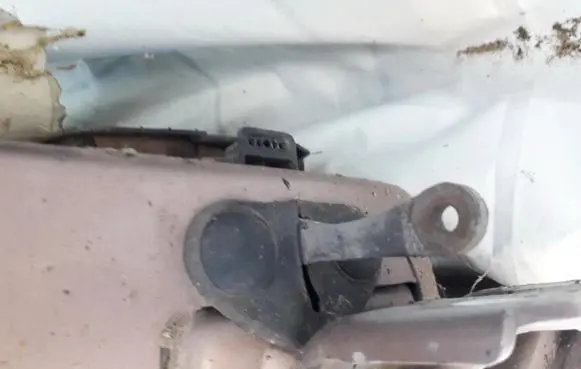 Front door check strap stopper