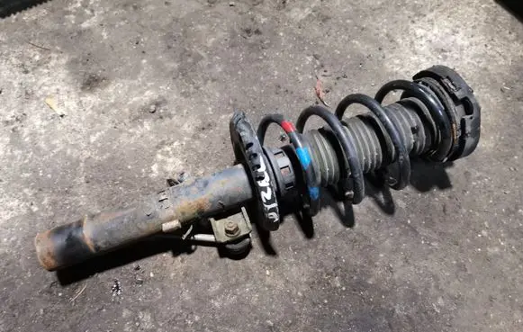 Volkswagen Fox Front shock absorber with coil spring