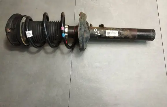 Volkswagen Golf VII Front shock absorber with coil spring 5Q0413023FH