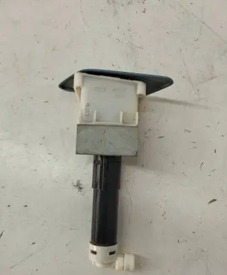 Nissan Leaf I (ZE0) Headlight washer spray nozzle 23372