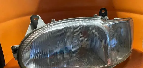 Ford Escort Headlight/headlamp 95AG13K060 205036B