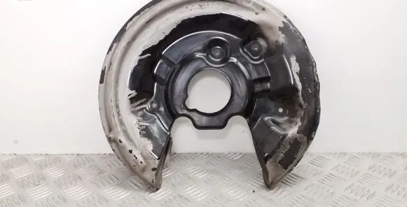 Volkswagen PASSAT B7 Rear brake disc plate dust cover 5N0615611C