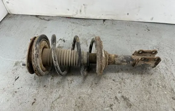 Suzuki Liana Front shock absorber with coil spring