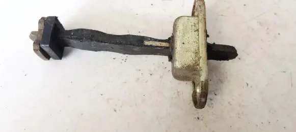 Front door check strap stopper