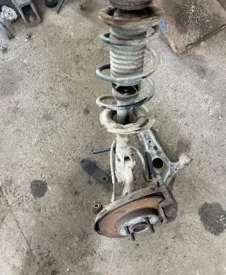 Front wheel hub spindle knuckle