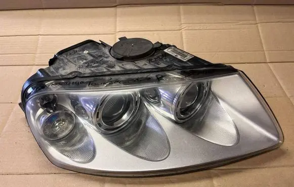 Volkswagen Touareg I Headlight/headlamp 7L6941016BK 89307861