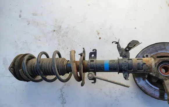 Renault Kangoo II Front shock absorber with coil spring 