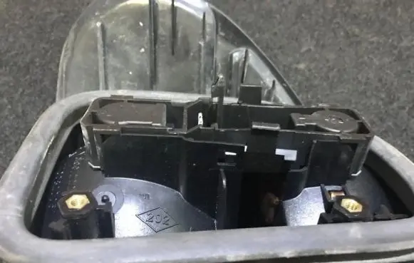 Renault Laguna I Tail light bulb cover holder