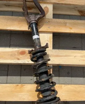 Front shock absorber with coil spring