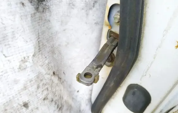 Mazda 626 Front door check strap stopper 