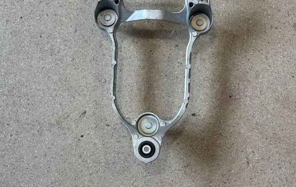 Hyundai Ioniq 5 A/C compressor mount bracket 97703GI000