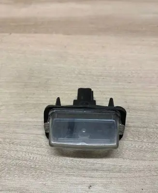 Toyota Yaris XP210 Trunk door license plate light bar 
