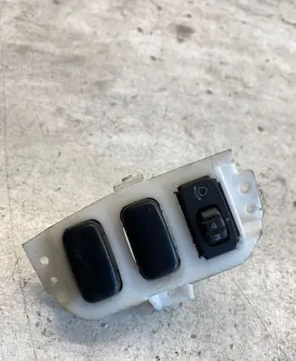 Mitsubishi Lancer X Headlight level height control switch
