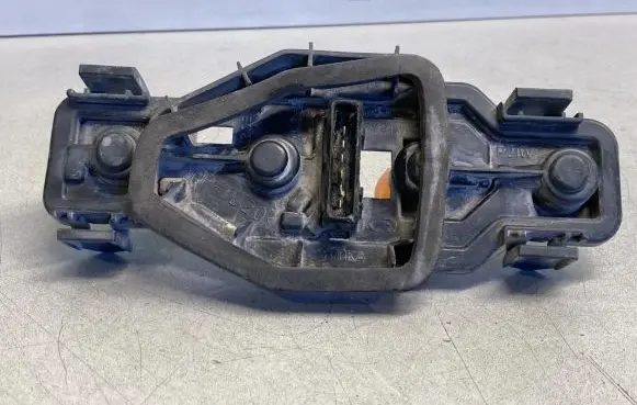 Tail light bulb cover holder