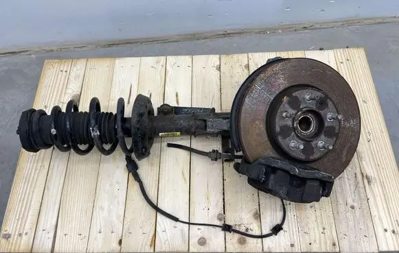Front shock absorber with coil spring