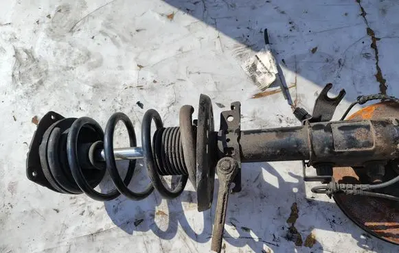 Renault Megane III Front shock absorber with coil spring