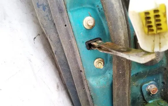 Mazda 323 F Rear door check strap stopper