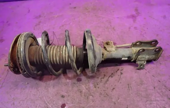 Suzuki Liana Front shock absorber with coil spring 