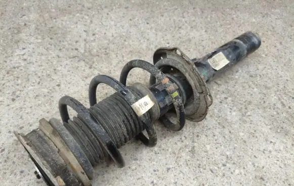 Volkswagen Tiguan Allspace Front shock absorber with coil spring 5QF413031AS