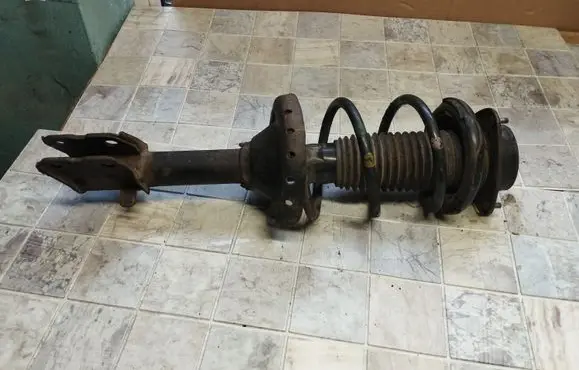 Subaru Outback Front shock absorber with coil spring