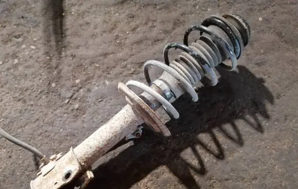Toyota Yaris Front shock absorber with coil spring