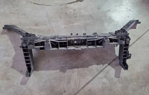 Top upper radiator support slam panel
