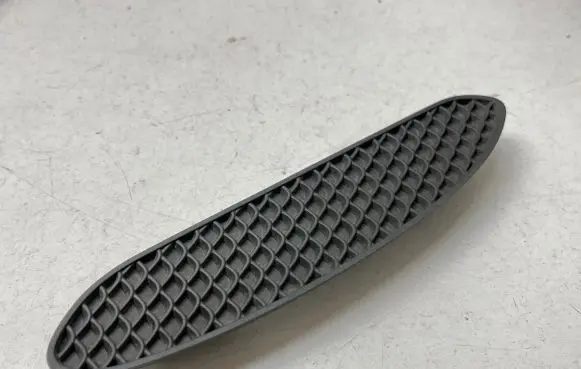 Rear bumper trim bar molding