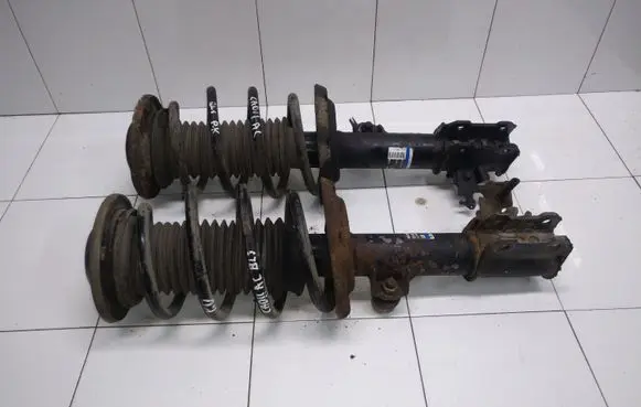 Cadillac BLS Front shock absorber with coil spring