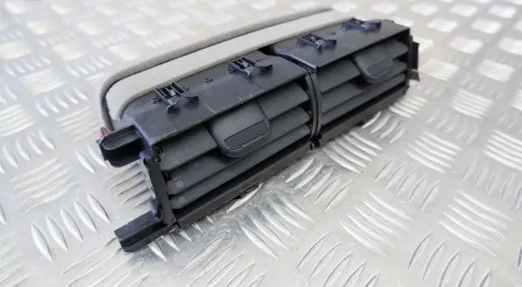 Toyota Yaris XP210 Dash center air vent grill 55670K0050
