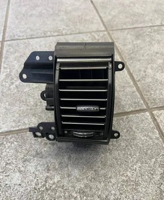 Jaguar XF X250 Dash center air vent grill CX2319K617AA CX2319K617