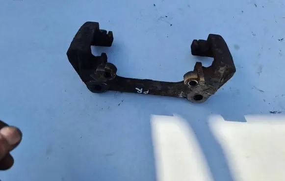 Volvo S60 Front Brake Caliper Pad/Carrier 