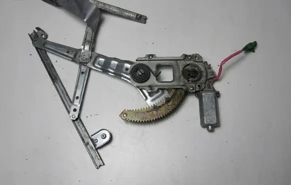 Subaru Impreza I Front door window regulator with motor