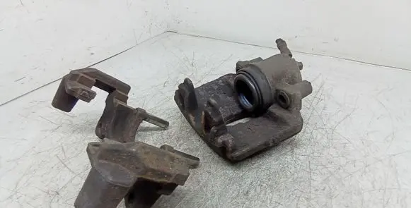 Volkswagen Touran I Front brake caliper 581