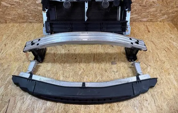 Radiator support slam panel