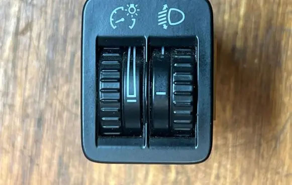 Headlight level height control switch