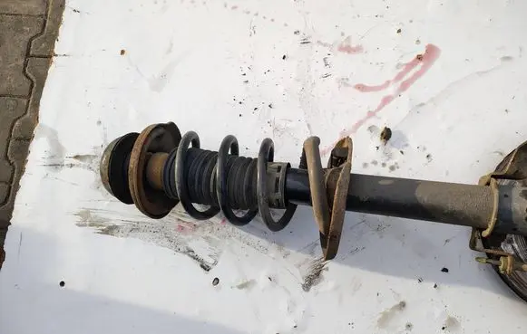 Dacia Dokker Front shock absorber with coil spring 