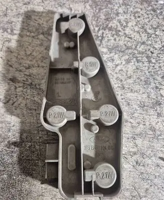 Tail light bulb cover holder