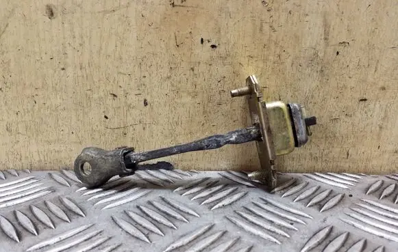 Subaru Outback Front door check strap stopper