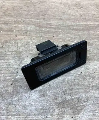 Volkswagen PASSAT B6 Number plate light 8T0943021
